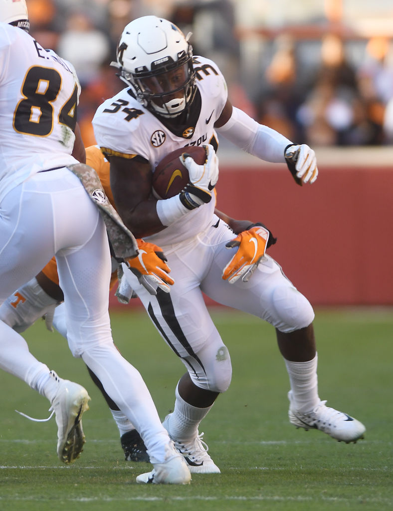 Missouri running back Larry Rountree III runs through a gap